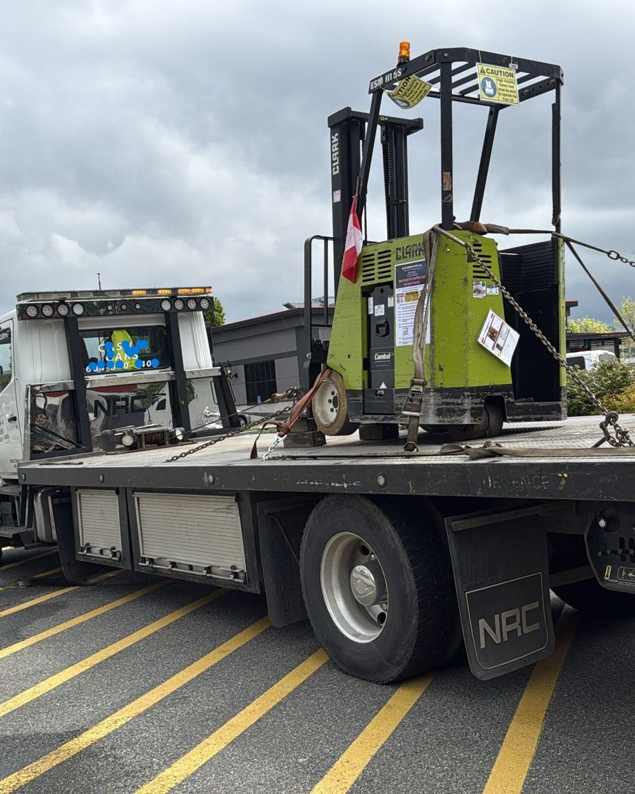 Warehouse forklift and lift equipment loaded for scrap removal in BC
