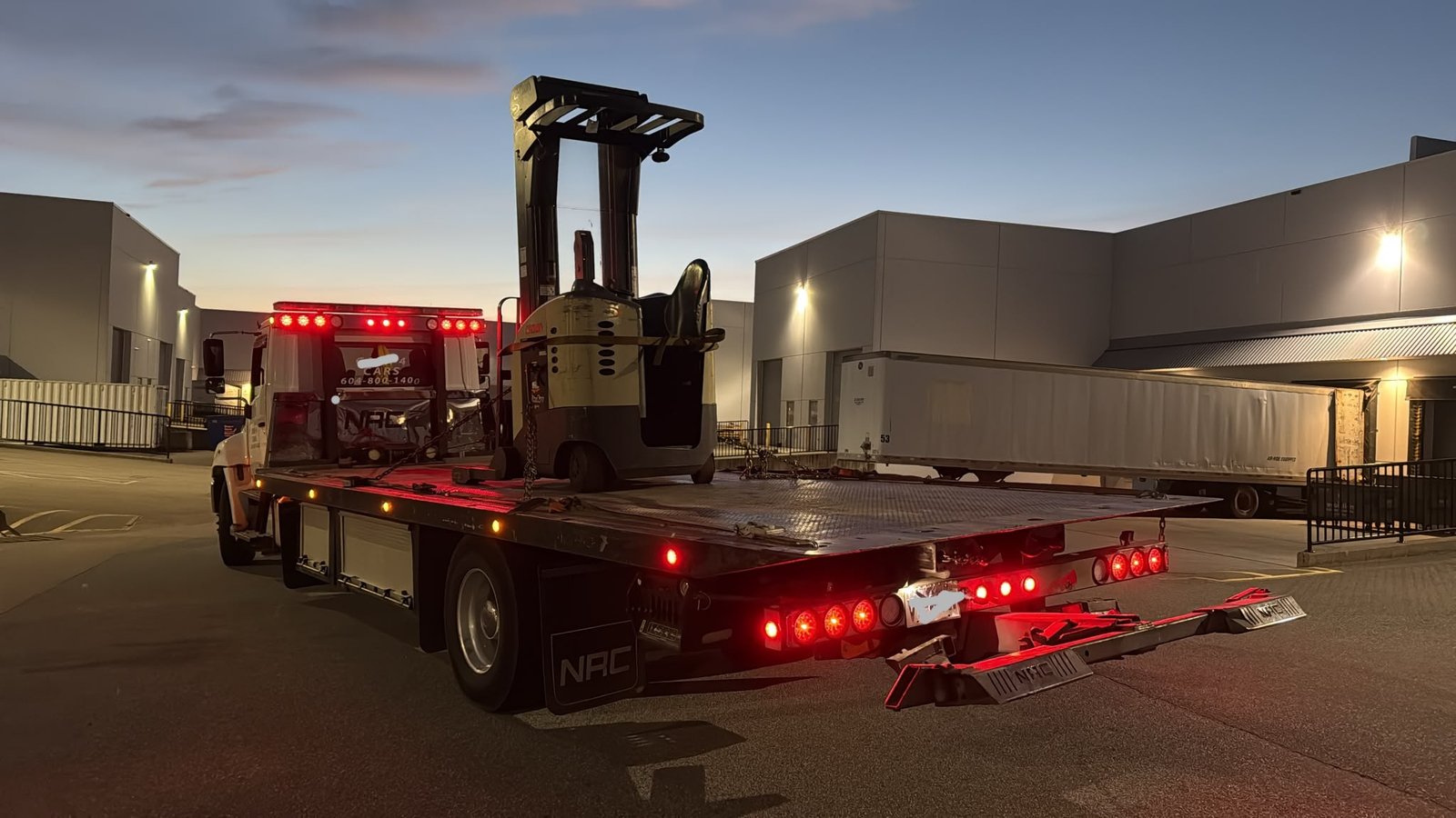 Electric counterbalance forklift picked up for removal in Metro Vancouver